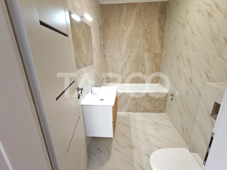 Apartament 3 camere decomandat - 2 bai - balcon - parcare - intabulat