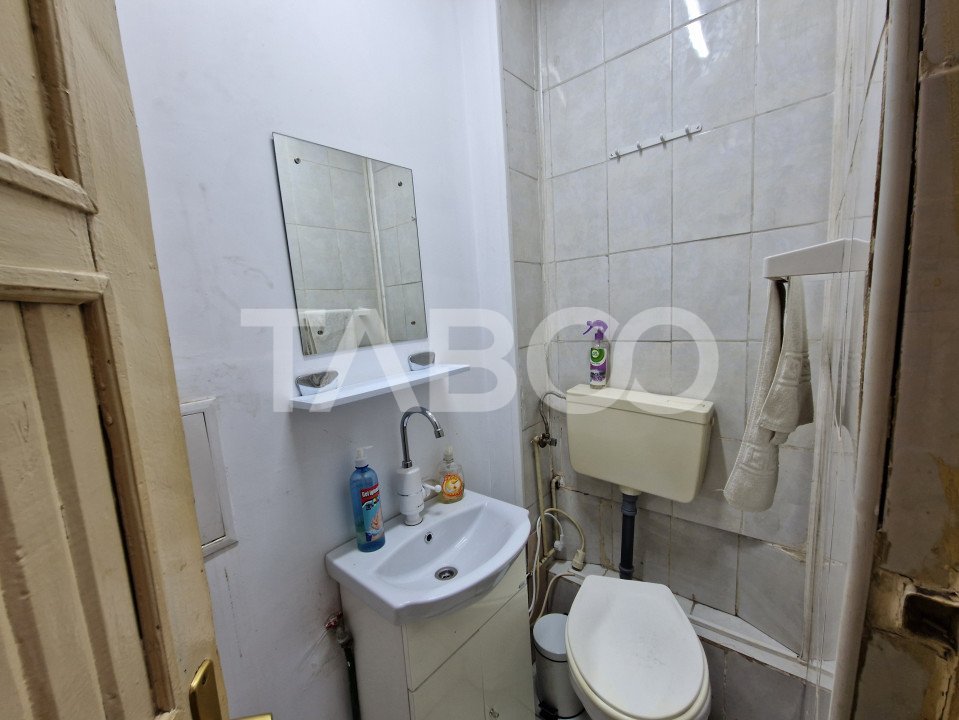 Apartament 4 camere spatiu comercial garaj si pivnita contral Sibiu