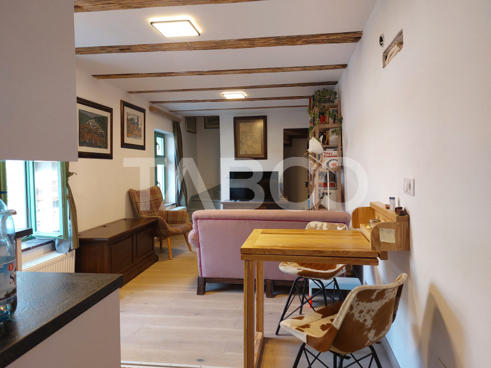 Apartament de vanzare 105 mp 3 camere curte 340 mp in acte Cisnadie