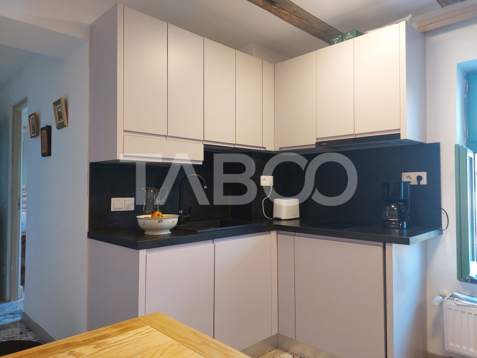 Apartament de vanzare 105 mp 3 camere curte 340 mp in acte Cisnadie