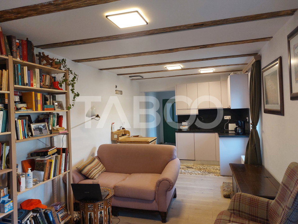 Apartament de vanzare 105 mp 3 camere curte 340 mp in acte Cisnadie