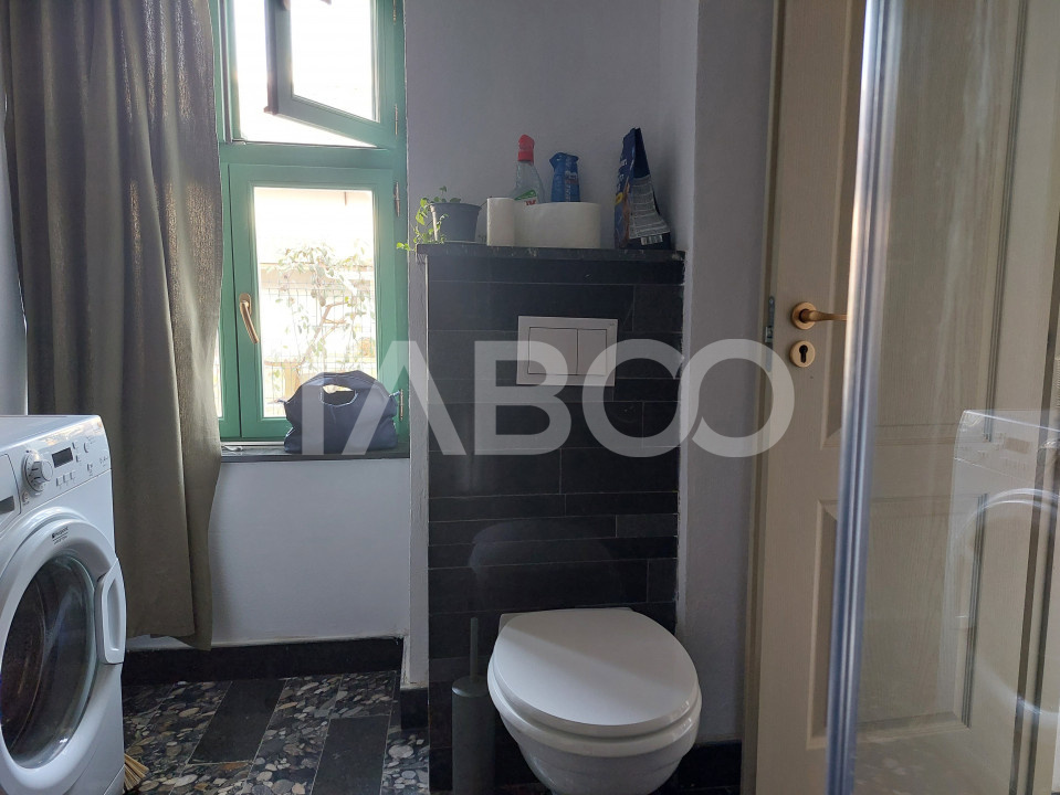 Apartament de vanzare 105 mp 3 camere curte 340 mp in acte Cisnadie