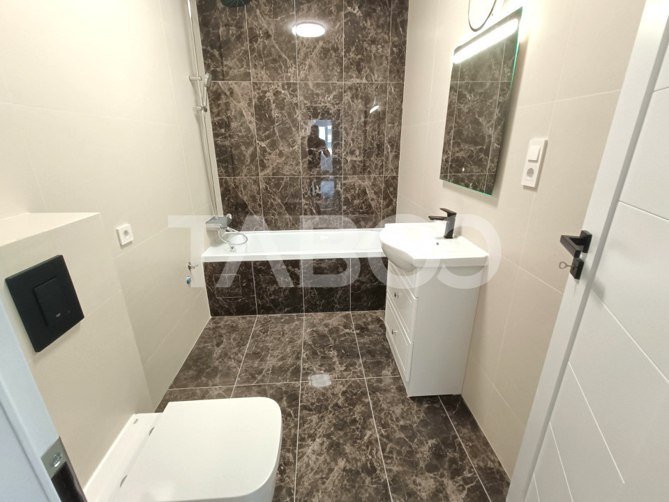 Apartament spatios 3 camere 2 bai - incalzire pardosea - parcare