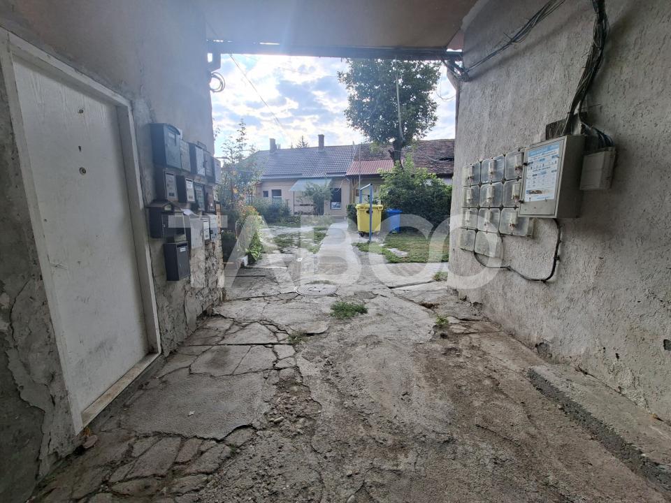 Garsoniera de vanzare aproape de centru cu bucatarie separata